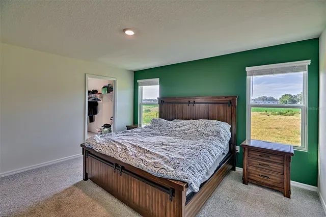 a bathroom with double sink and a mirror