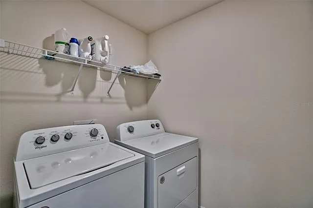 a bedroom with a bed and a chair