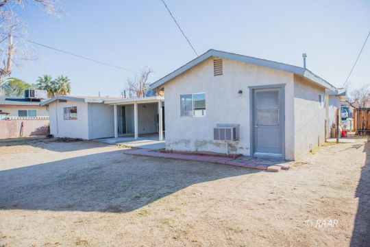 316 West Howell Avenue Ridgecrest, CA 93555 - Photo 23 of 31 a front view of a house with a yard and garage