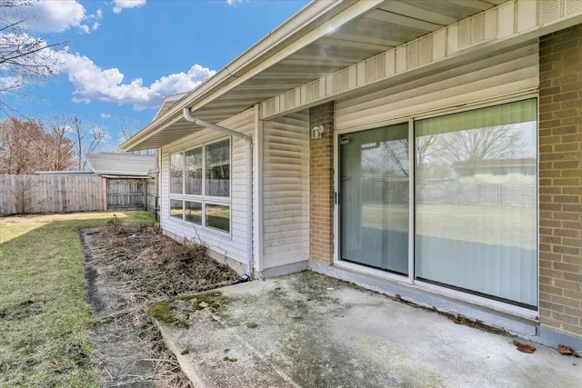 a large white building with a large pool