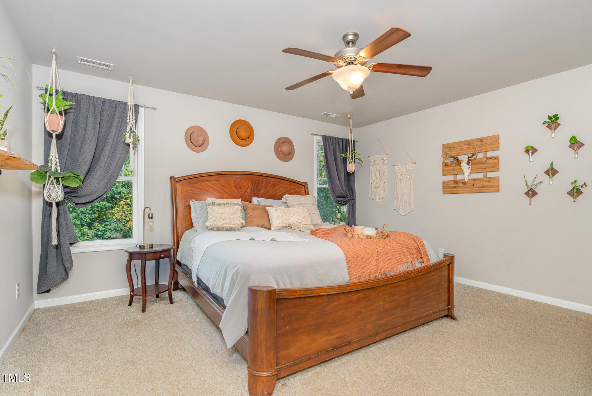 170 Willow Ridge Circle Willow Spring, NC 27592 - Photo 12 of 21 a bedroom with a bed and a chandelier