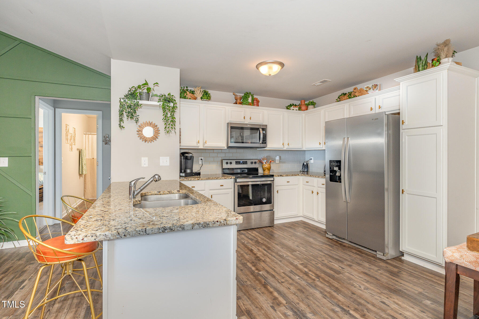 170 Willow Ridge Circle Willow Spring, NC 27592 - Photo 6 of 21 a kitchen with granite countertop a refrigerator stove top oven and sink