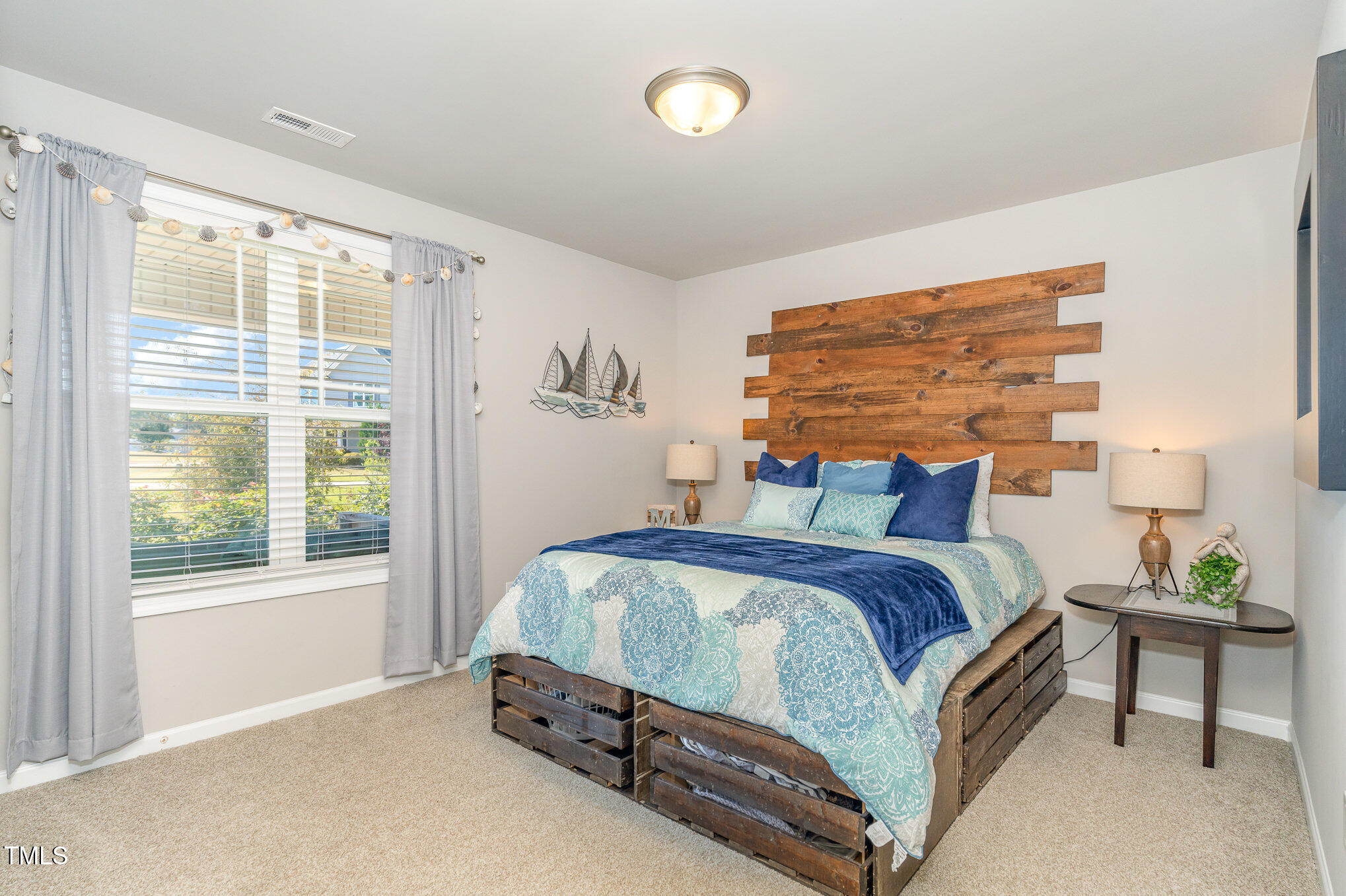 170 Willow Ridge Circle Willow Spring, NC 27592 - Photo 9 of 21 a bedroom with a bed and a window