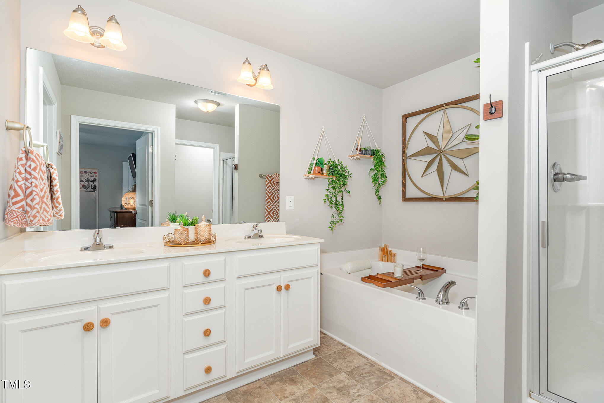 170 Willow Ridge Circle Willow Spring, NC 27592 - Photo 10 of 21 a bathroom with a double vanity sink mirror and bathtub