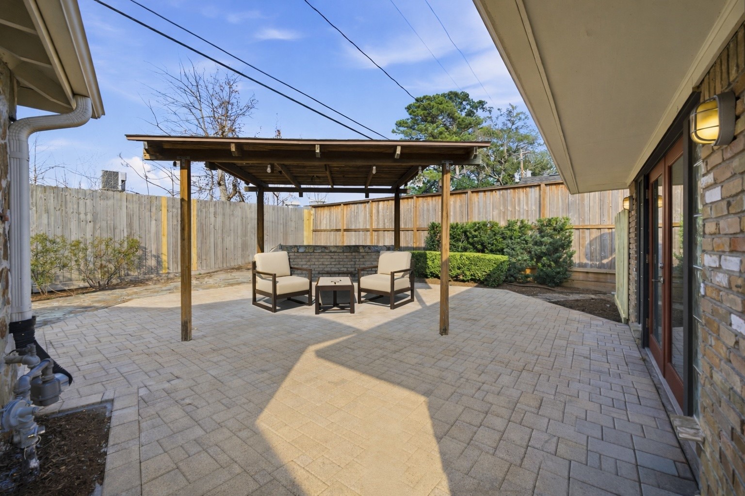 531 Azaleadell Drive Houston, TX 77018 - Photo 30 of 37 **Virtually Staged** The custom pergola structure adds architectural interest and shade, creating a defined outdoor living space that feels both functional and welcoming. String lighting details elevate the ambiance for evening use.