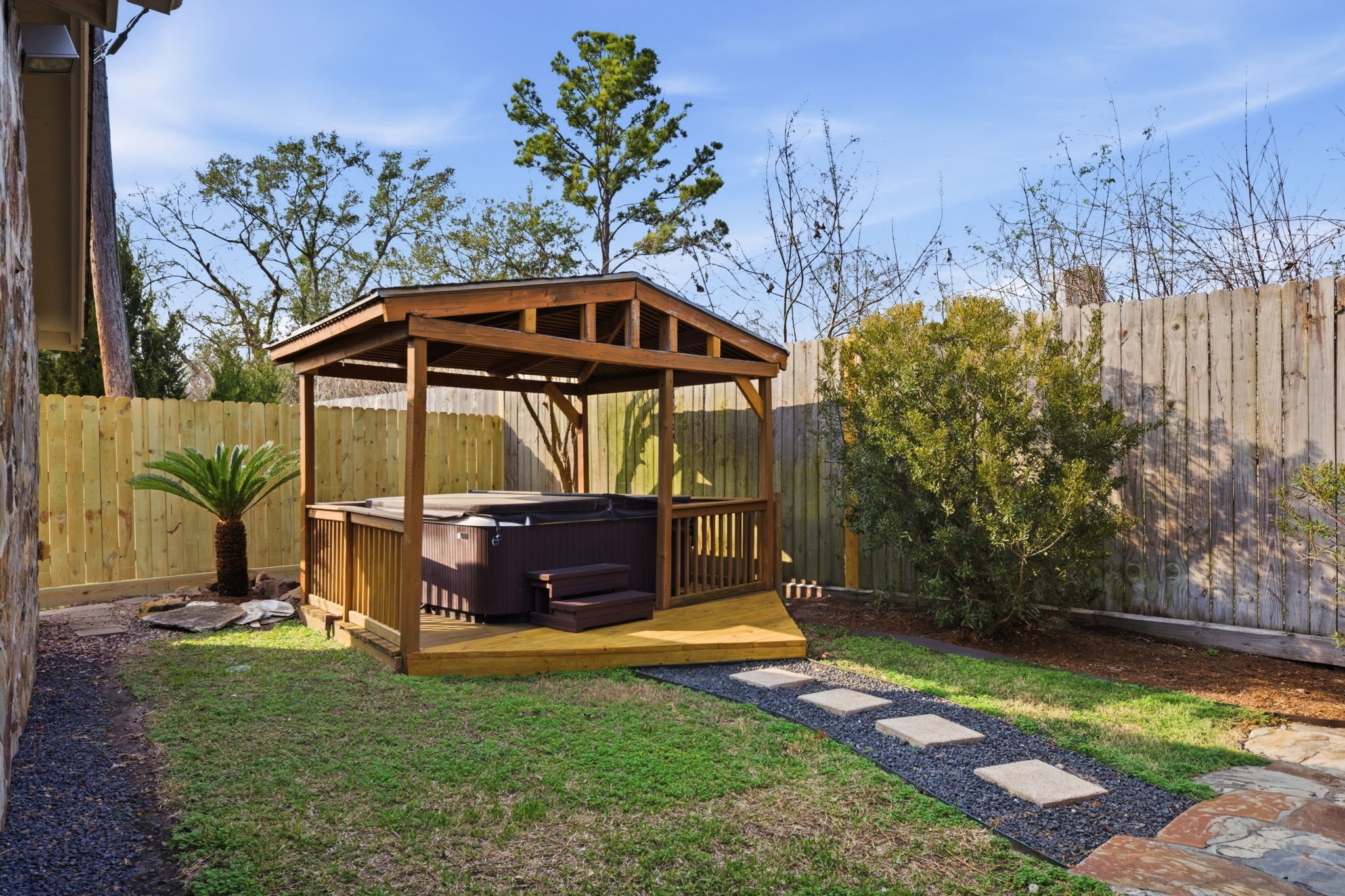 531 Azaleadell Drive Houston, TX 77018 - Photo 31 of 37 The backyard also features a private spa area tucked beneath its own covered structure, offering a relaxing retreat at the end of the day. The combination of deck, pavers, pergola, and spa creates a complete outdoor living experience designed for both comfort and entertaining.