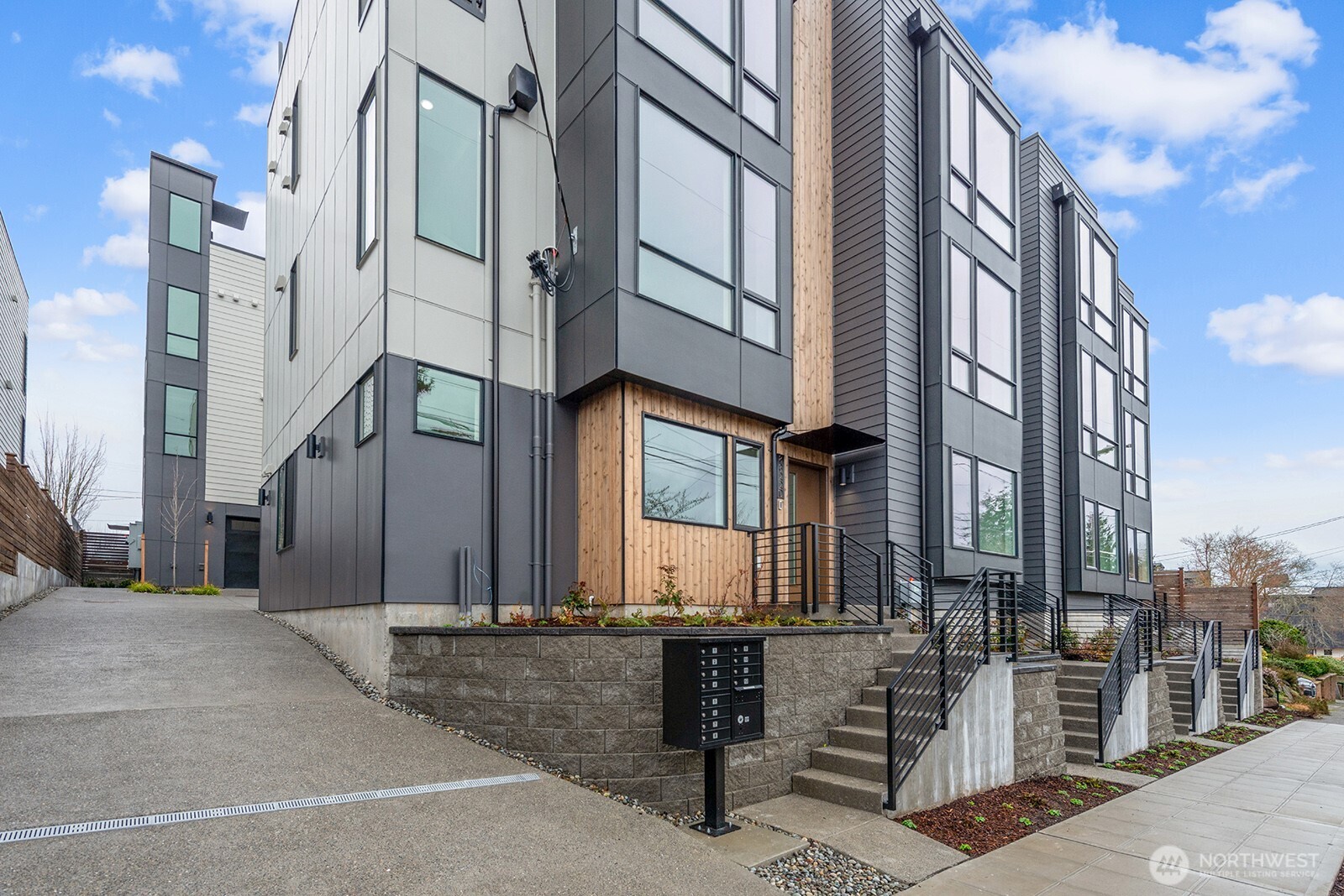 8322 16th Avenue Northwest, Unit D Seattle, WA 98117 - Photo 1 of 24 a view of a brick building with many windows
