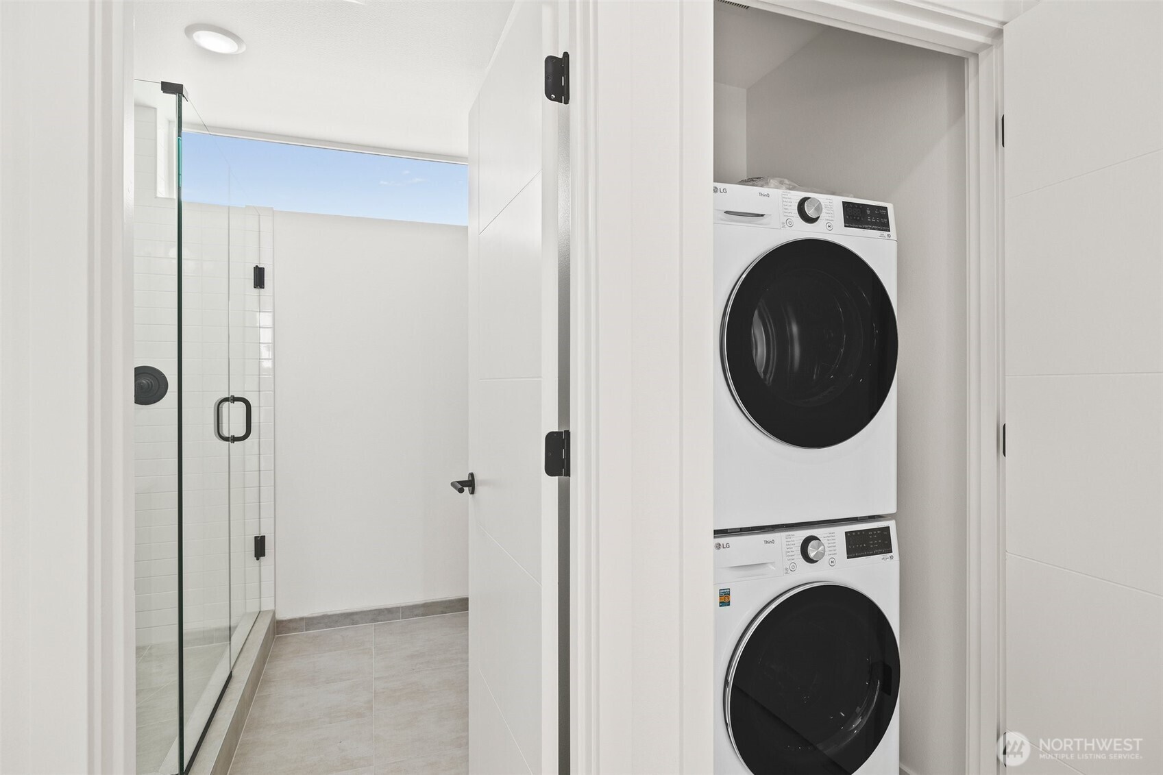 8322 16th Avenue Northwest, Unit D Seattle, WA 98117 - Photo 17 of 24 a view of a hallway with washer and dryer