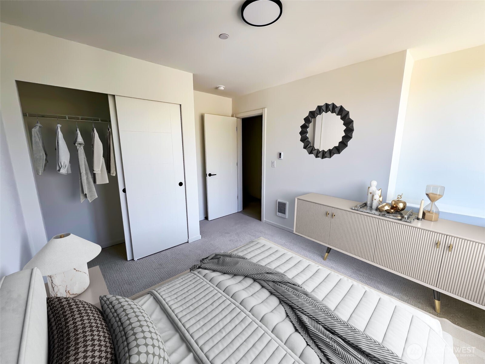 8322 16th Avenue Northwest, Unit D Seattle, WA 98117 - Photo 21 of 24 a bedroom with bed and a chandelier