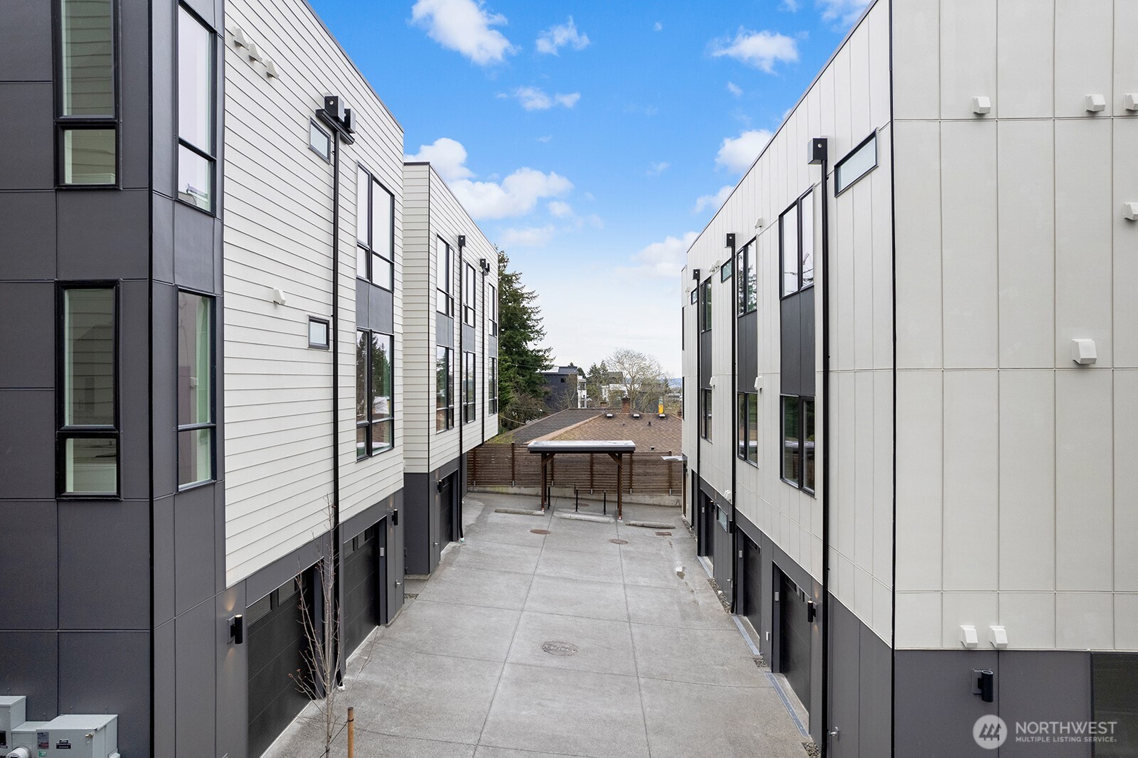 8322 16th Avenue Northwest, Unit D Seattle, WA 98117 - Photo 23 of 24 a view of a balcony with wooden fence