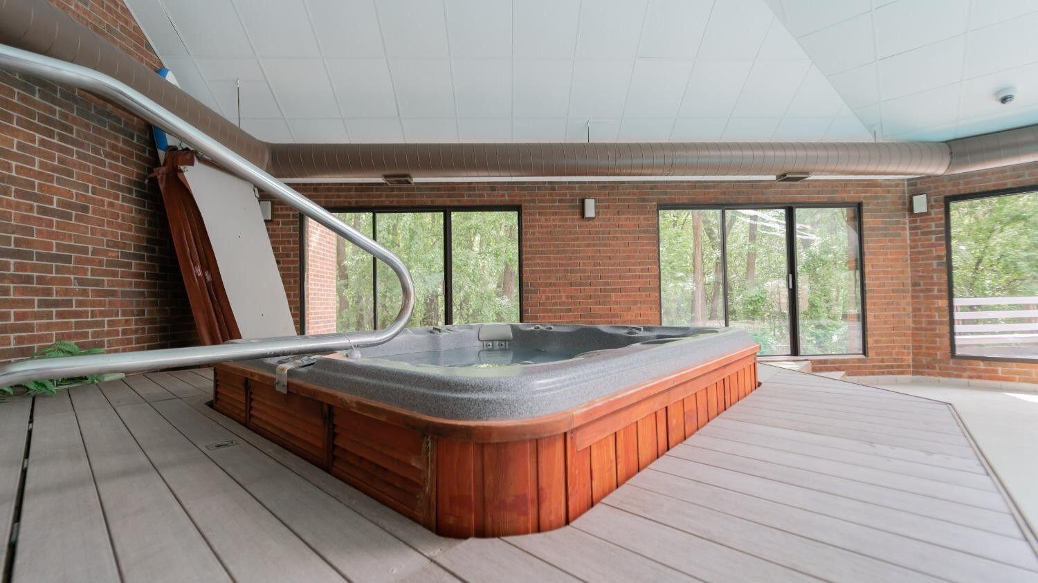 910 Ridge Road, Unit 405 Munster, IN 46321 - Photo 28 of 37 a room with a large window and bed