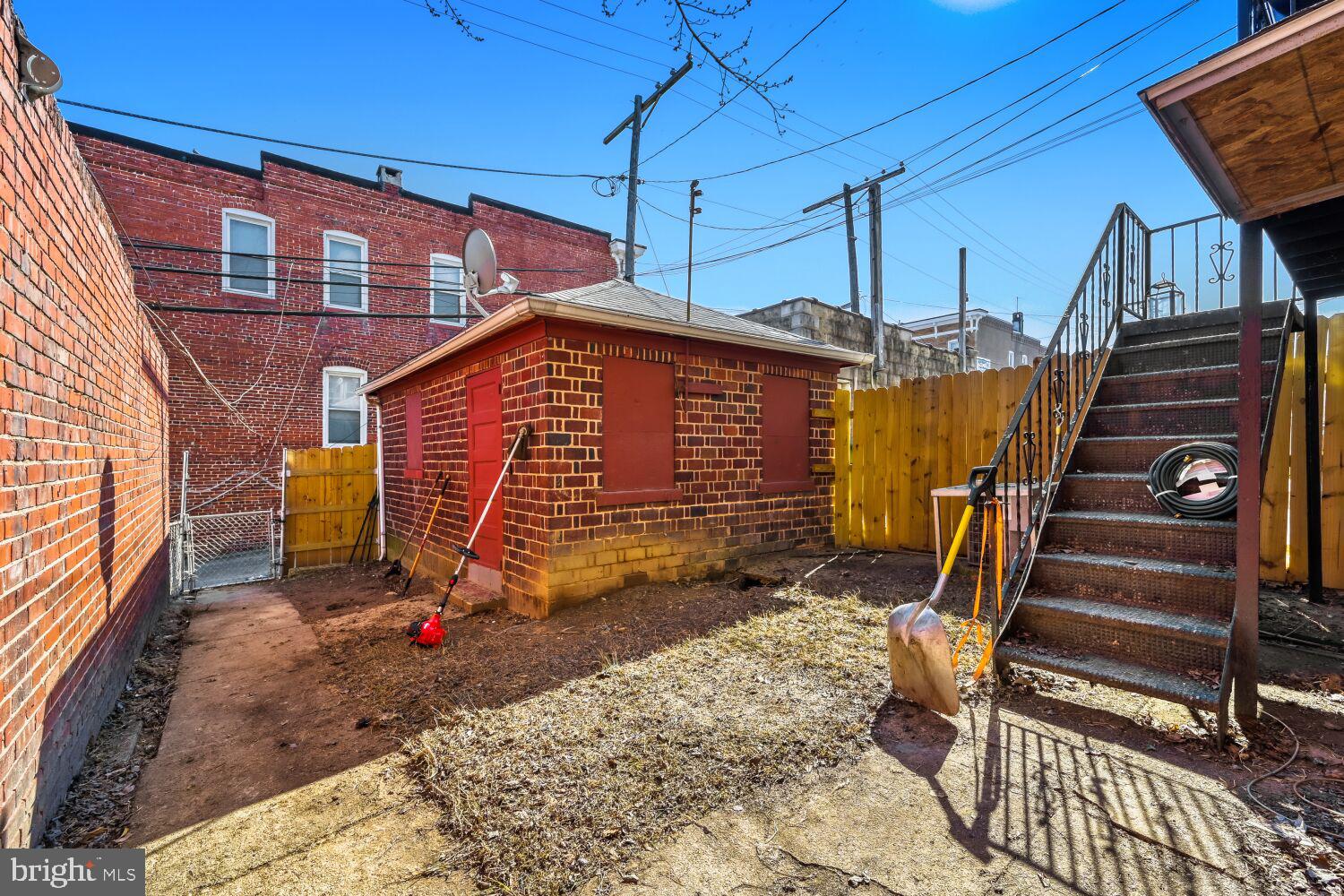 3703 Belair Road Baltimore, MD 21213 - Photo 20 of 22 a backyard of a house with barbeque oven table and chairs