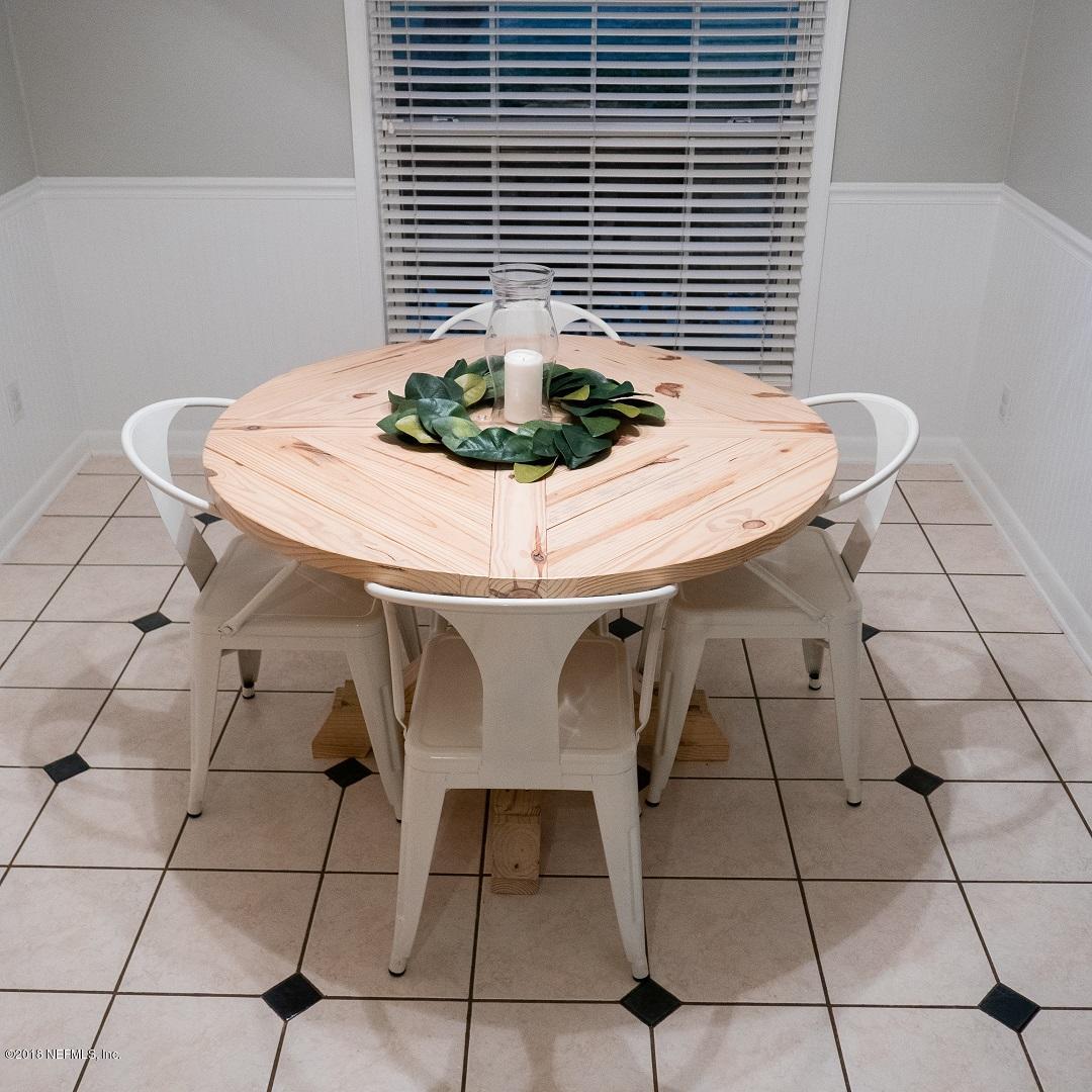8918 San Rae Road Jacksonville, FL 32257 - Photo 20 of 33 a dining room with table and chairs
