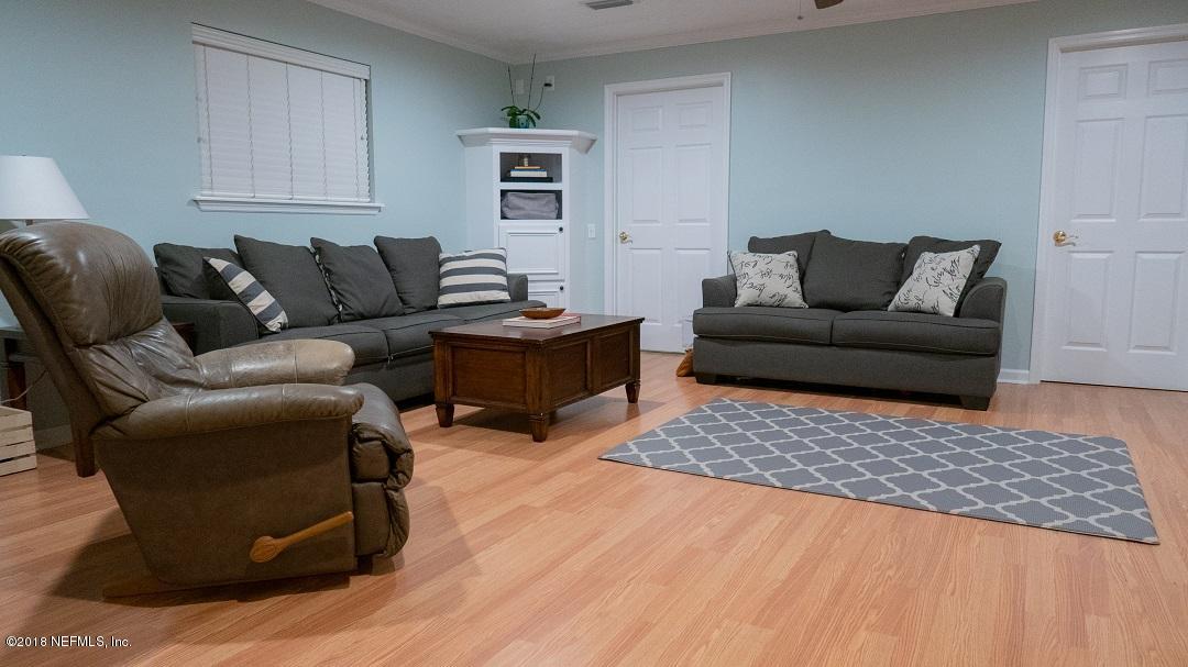 8918 San Rae Road Jacksonville, FL 32257 - Photo 22 of 33 a living room with furniture and a rug