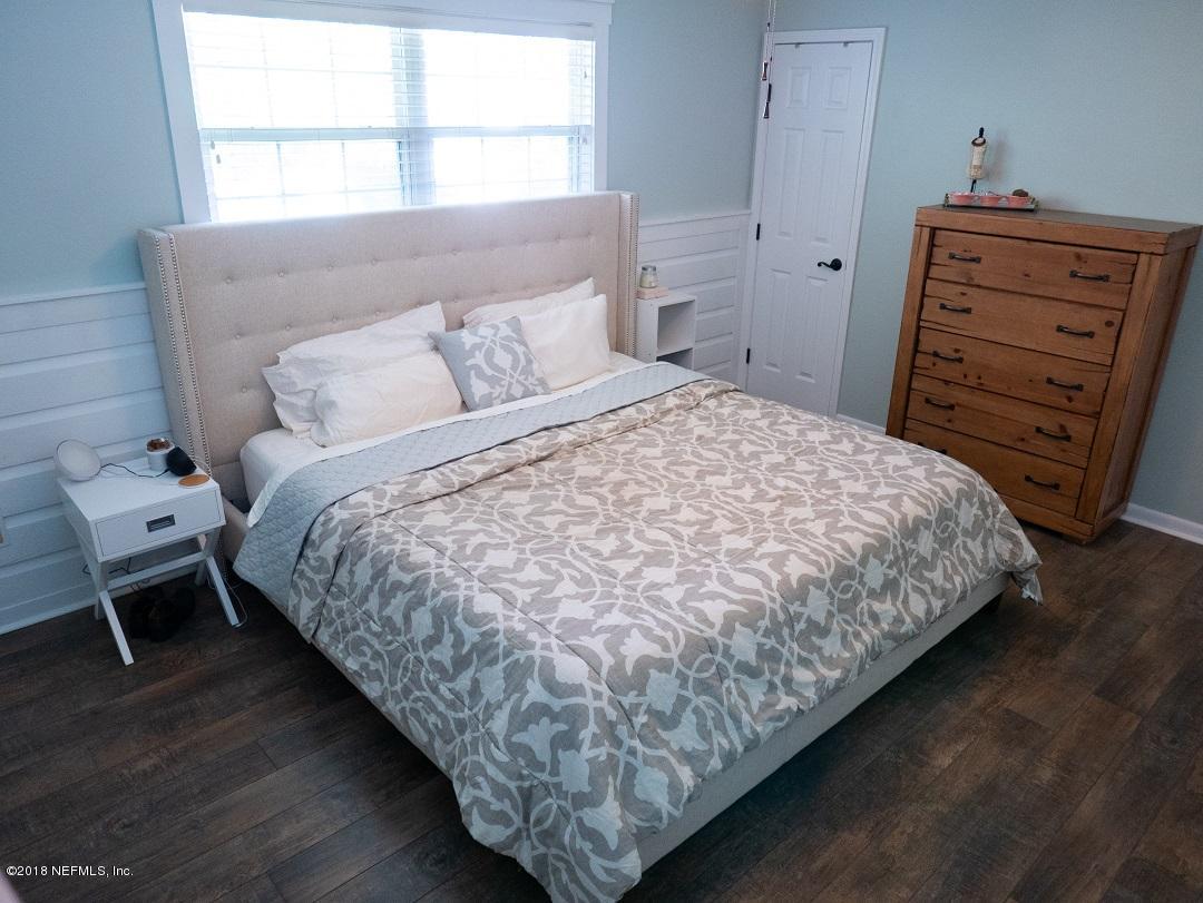 8918 San Rae Road Jacksonville, FL 32257 - Photo 25 of 33 a bedroom with a bed and a window