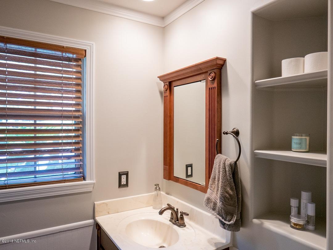 8918 San Rae Road Jacksonville, FL 32257 - Photo 26 of 33 a bathroom with a sink and a mirror