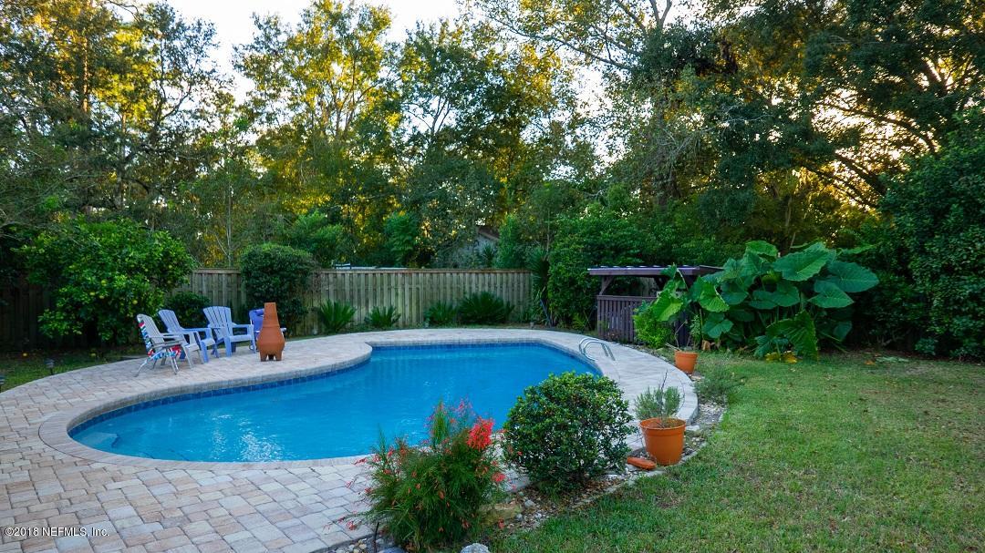 8918 San Rae Road Jacksonville, FL 32257 - Photo 3 of 33 a view of backyard with swimming pool and outdoor seating