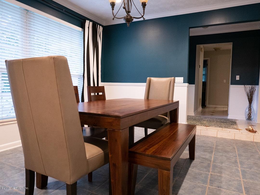 8918 San Rae Road Jacksonville, FL 32257 - Photo 32 of 33 a view of a dining room with furniture and wooden floor
