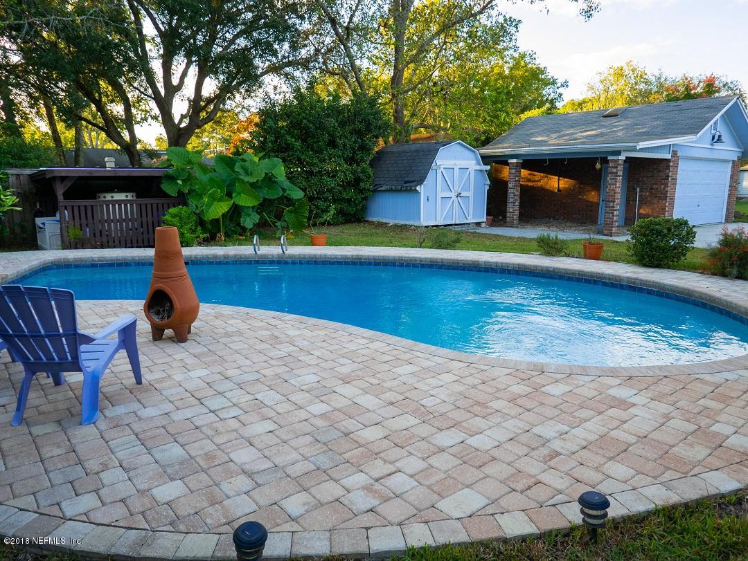 8918 San Rae Road Jacksonville, FL 32257 - Photo 5 of 33 a house view with a seating space and garden view