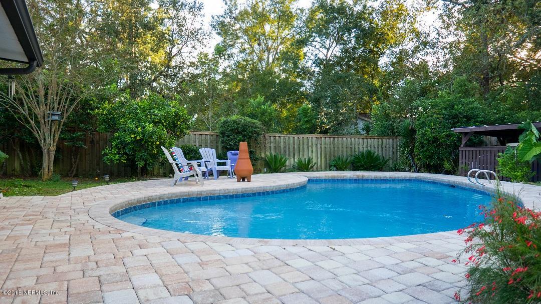 8918 San Rae Road Jacksonville, FL 32257 - Photo 6 of 33 a view of a swimming pool and a yard