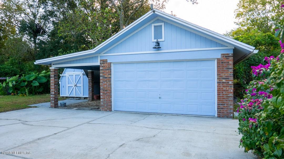 8918 San Rae Road Jacksonville, FL 32257 - Photo 10 of 33 a front view of house with garage and trees
