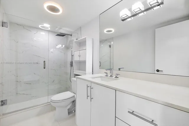 an aerial view of a house with yard and mountain view in back