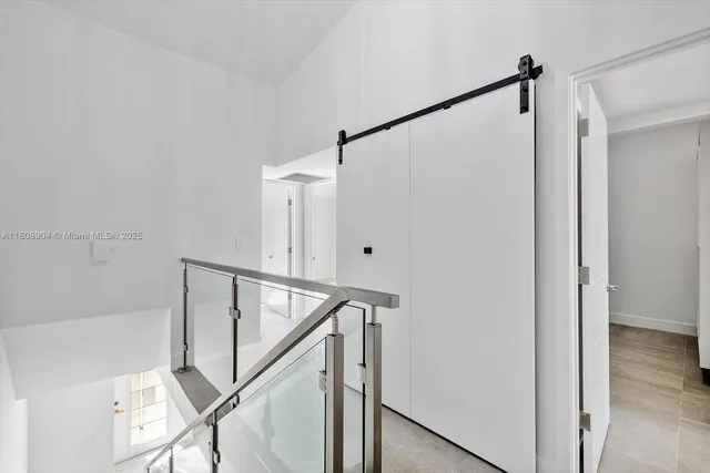 a front view of a multi story residential apartment building with a yard