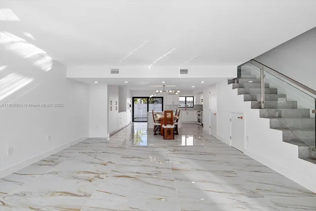 a view of a livingroom with furniture and lots of space