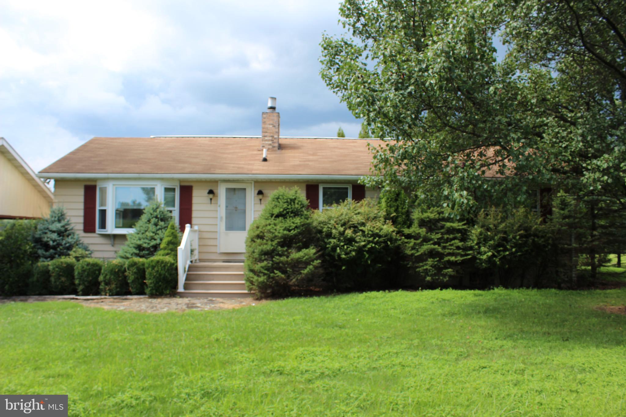 801 Boyle Road Fairfield, PA 17320 - Photo 3 of 38 a front view of a house with a garden