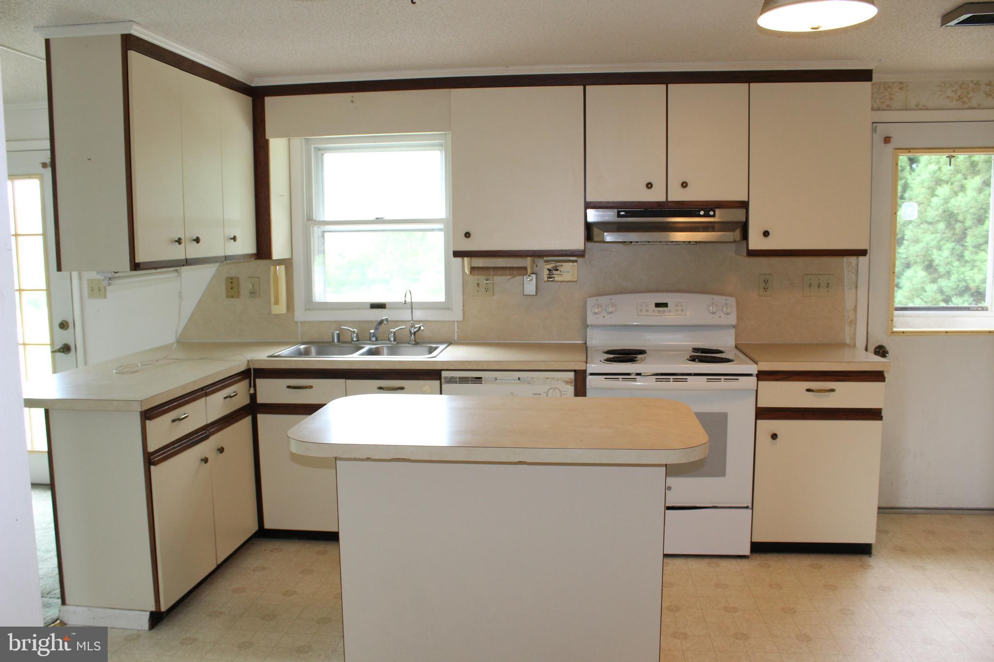 801 Boyle Road Fairfield, PA 17320 - Photo 22 of 38 a kitchen with kitchen island a sink cabinets and window