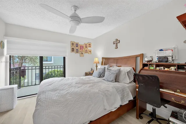 a bedroom with a large bed and a large window