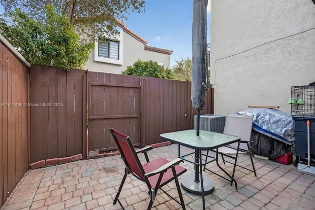 a view of a chairs and tables in the patio