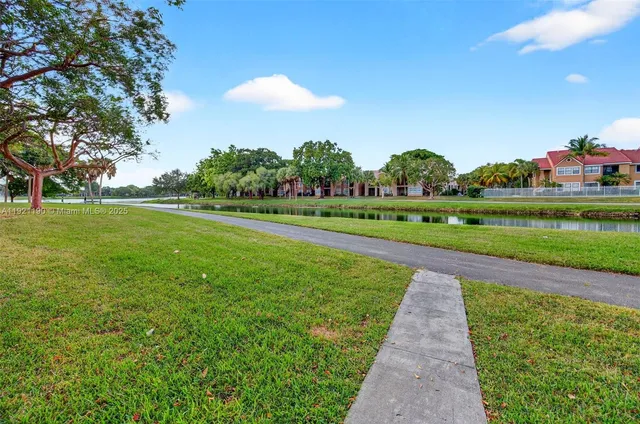 a view of a golf course with a lake