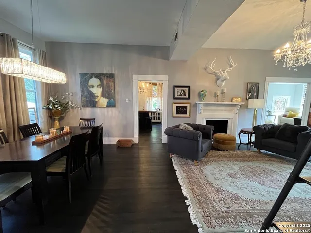 a living room with furniture flat screen tv and a fireplace