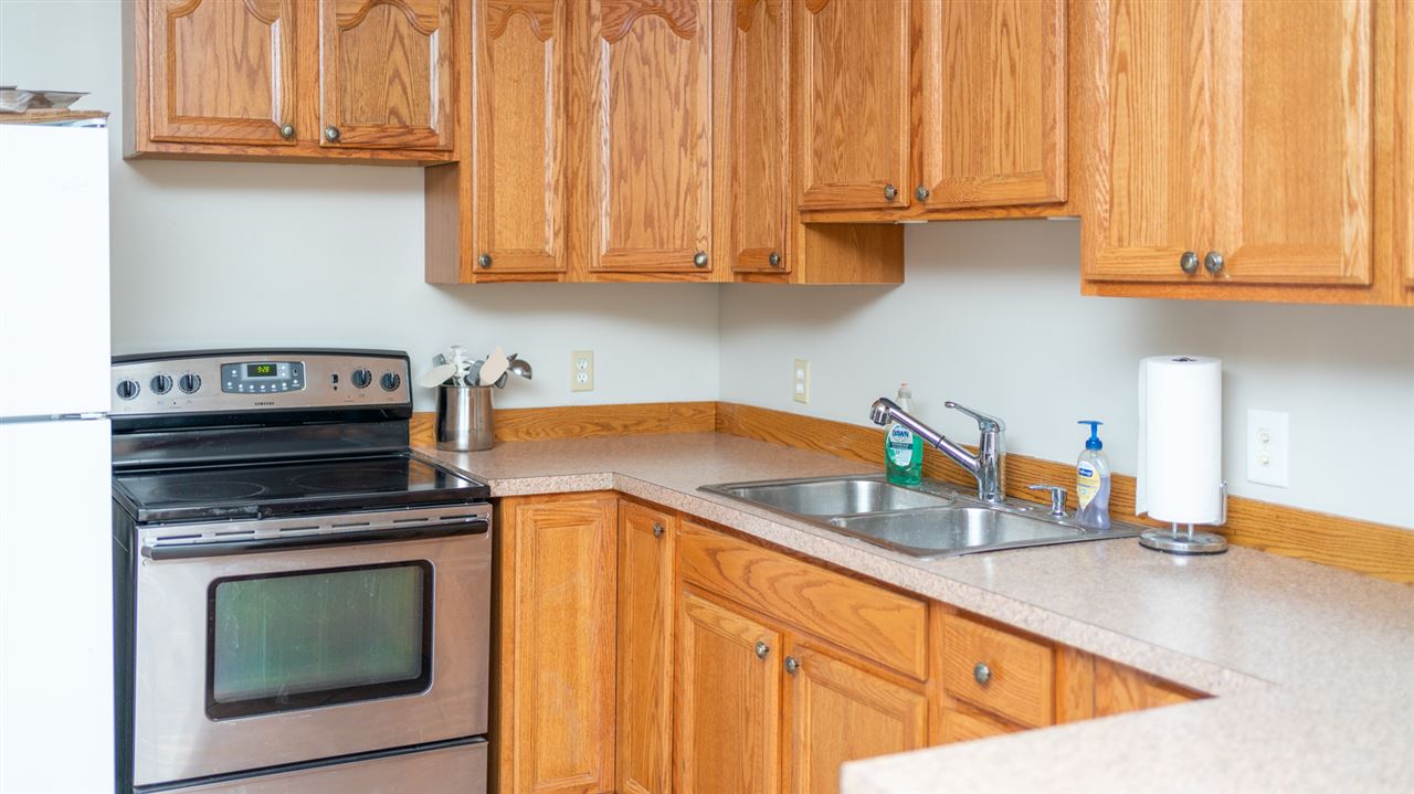 4740 Morris Mill Road Swoope, VA 24479 - Photo 46 of 50 a kitchen with granite countertop a sink a stove and cabinets