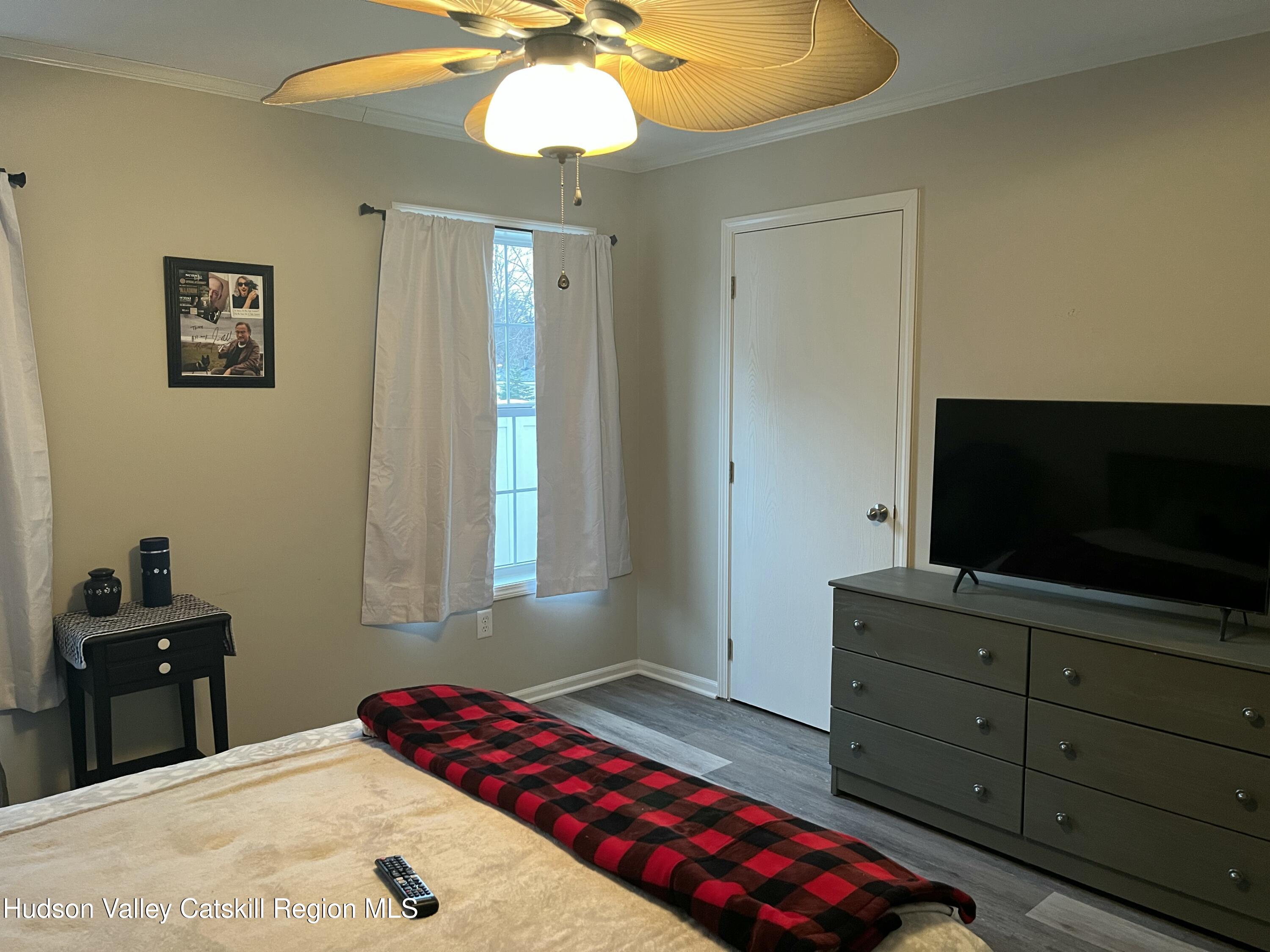 13 Mahoney Road Stuyvesant, NY 12173 - Photo 14 of 19 a bedroom with a bed and a flat screen tv