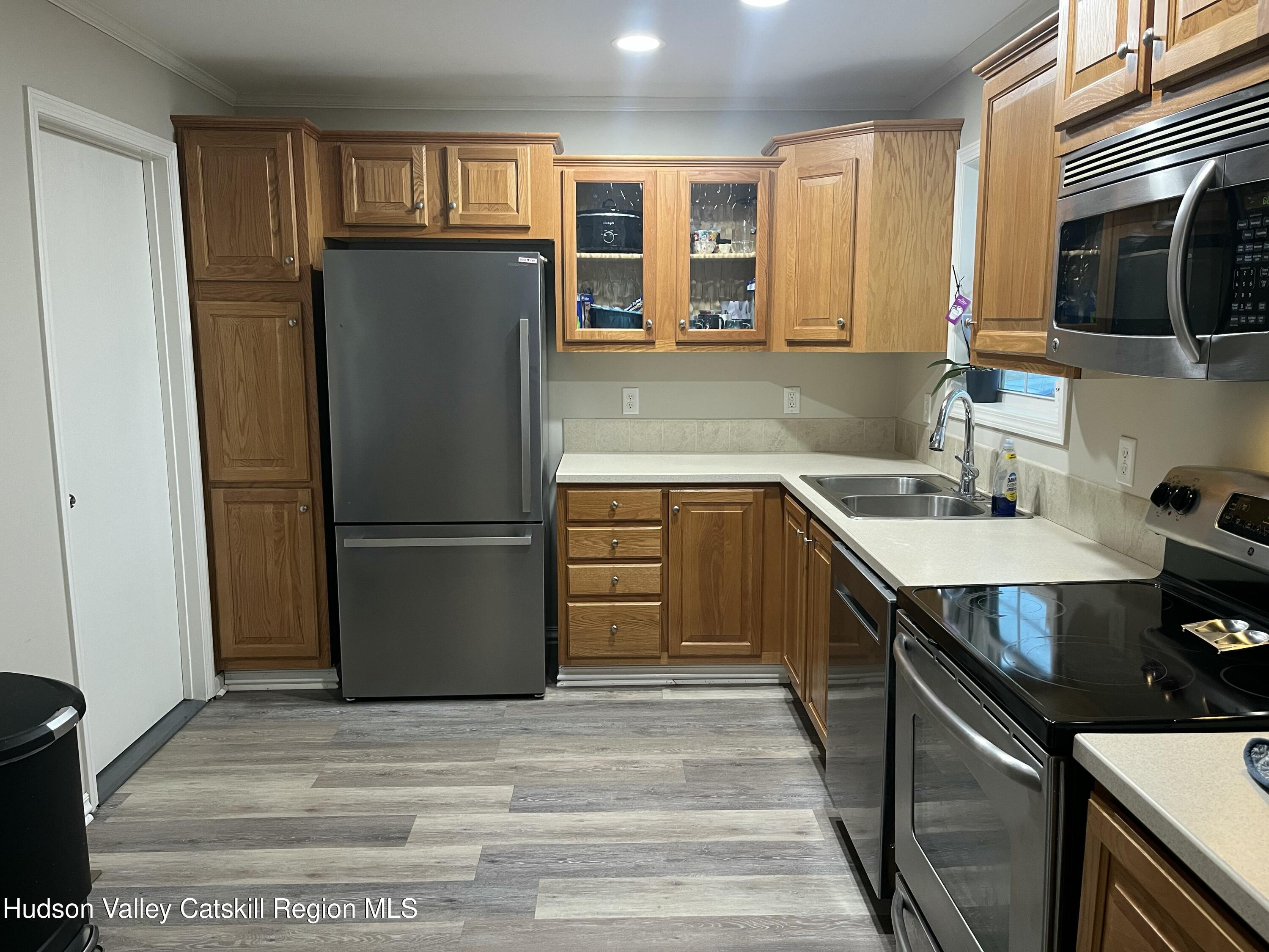 13 Mahoney Road Stuyvesant, NY 12173 - Photo 2 of 19 a kitchen with stainless steel appliances granite countertop a refrigerator stove and sink