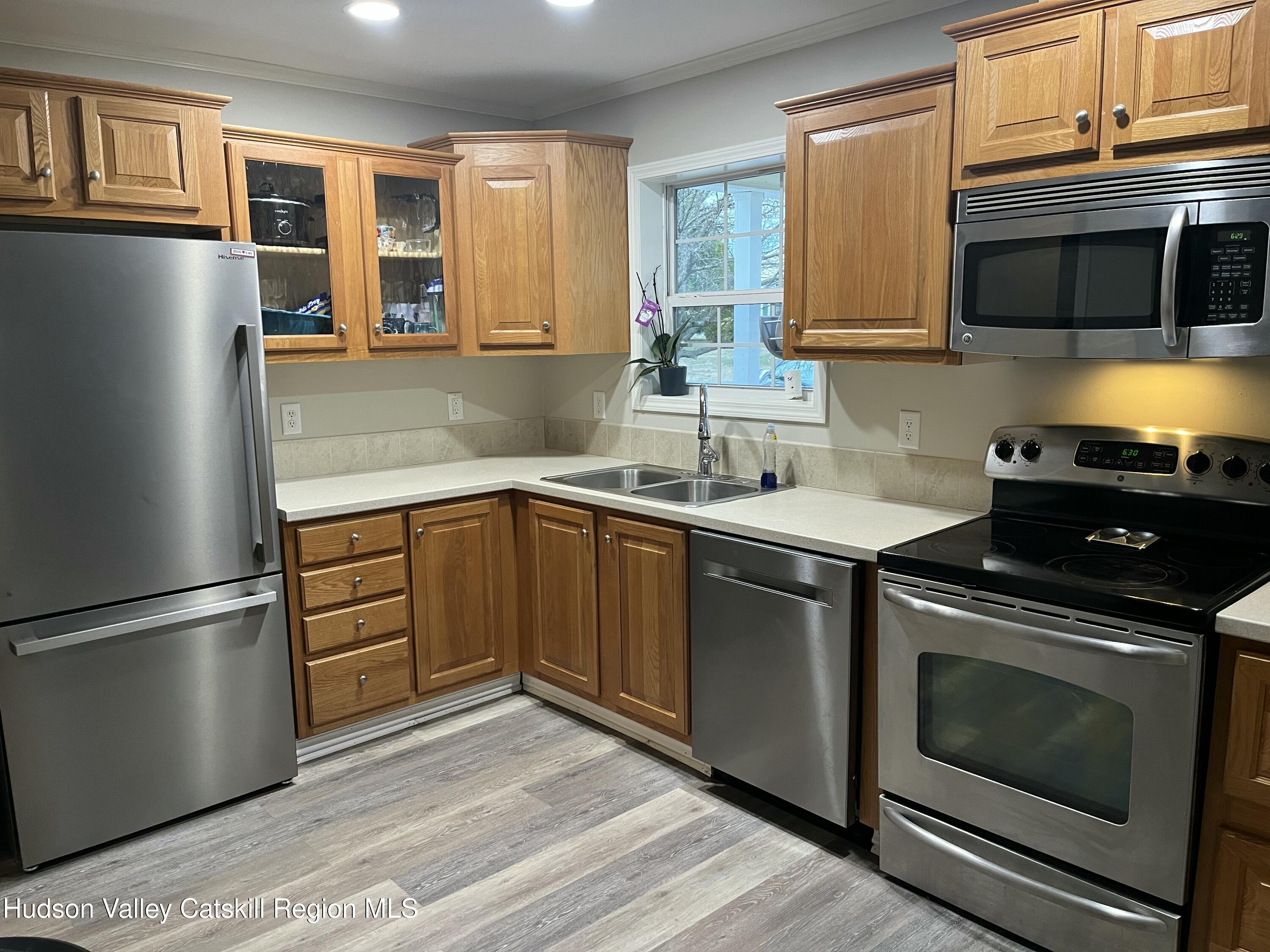 13 Mahoney Road Stuyvesant, NY 12173 - Photo 3 of 19 a kitchen with stainless steel appliances granite countertop a stove a sink dishwasher a refrigerator and a microwave oven