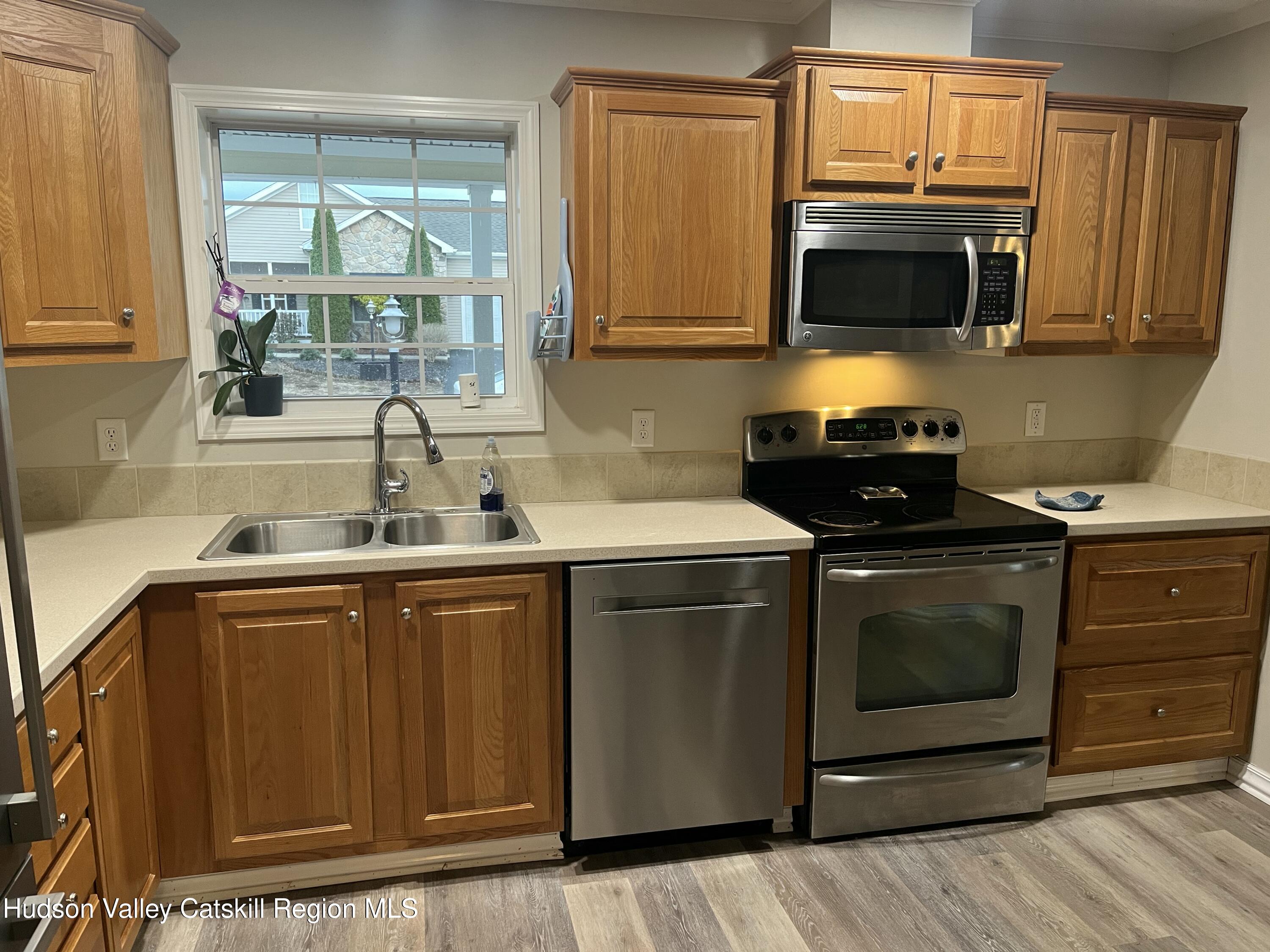 13 Mahoney Road Stuyvesant, NY 12173 - Photo 4 of 19 a kitchen with a sink stove and microwave
