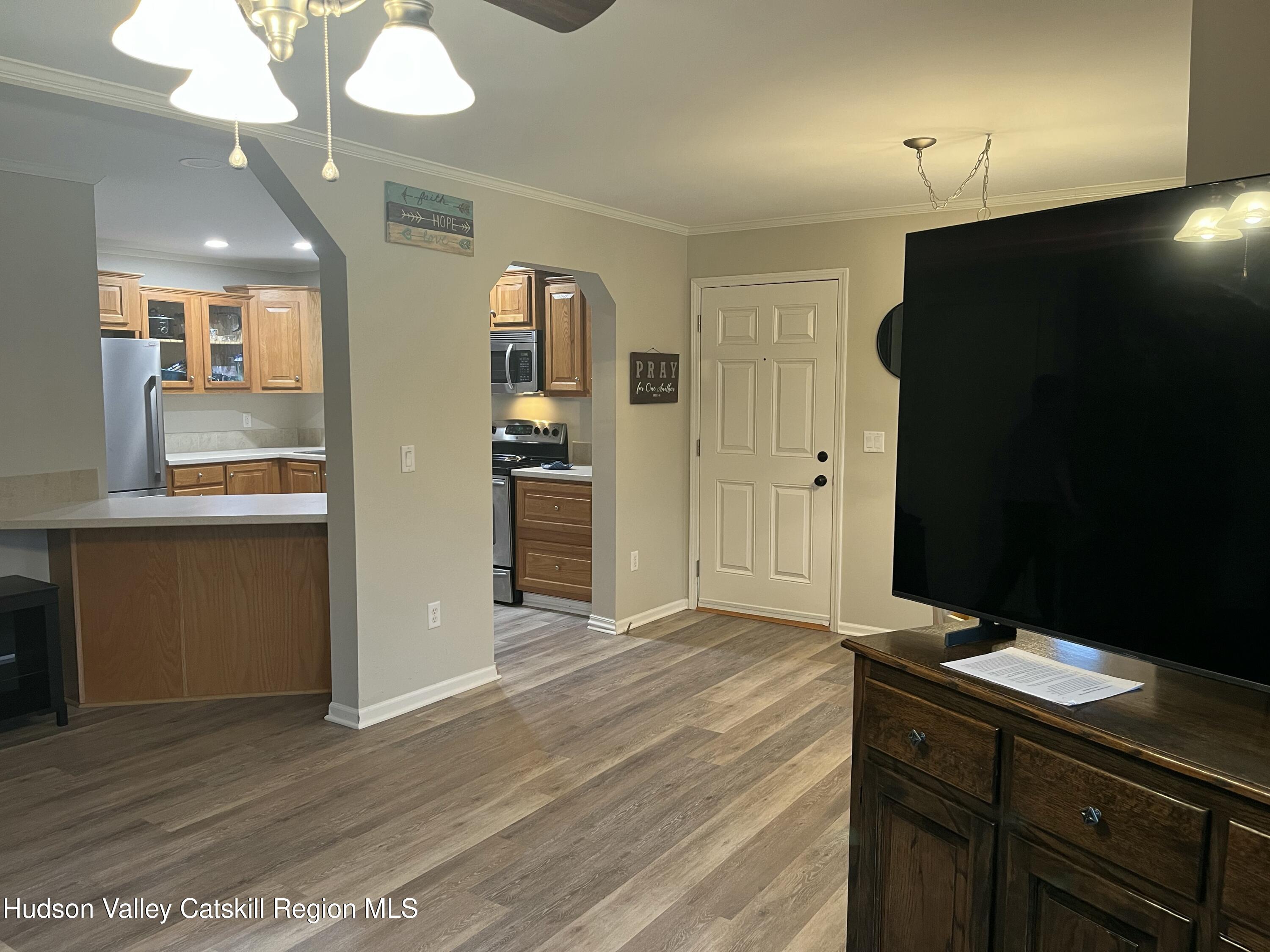 13 Mahoney Road Stuyvesant, NY 12173 - Photo 5 of 19 wooden floor in an empty room with a mirror