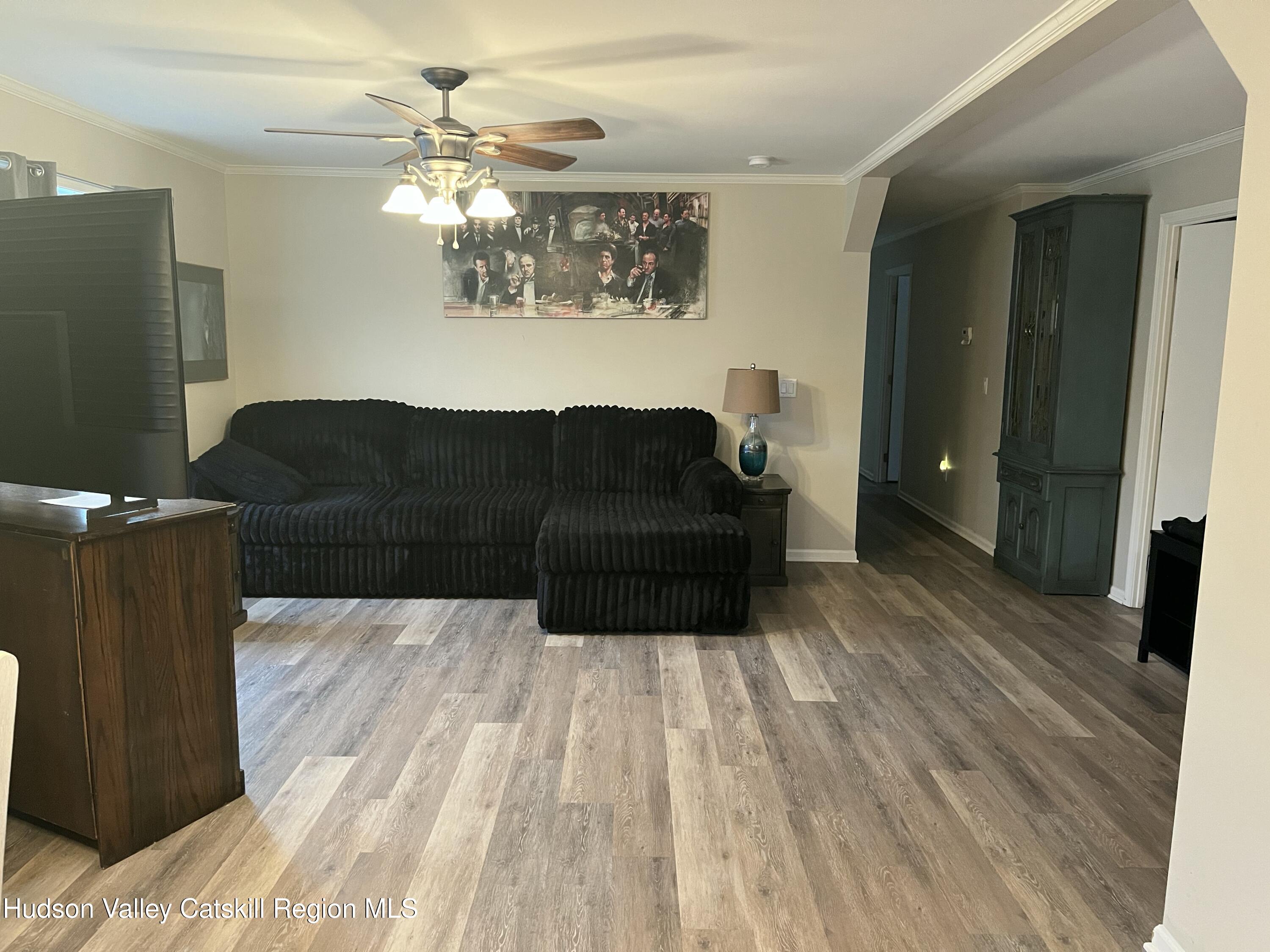13 Mahoney Road Stuyvesant, NY 12173 - Photo 6 of 19 a living room with furniture and a chandelier