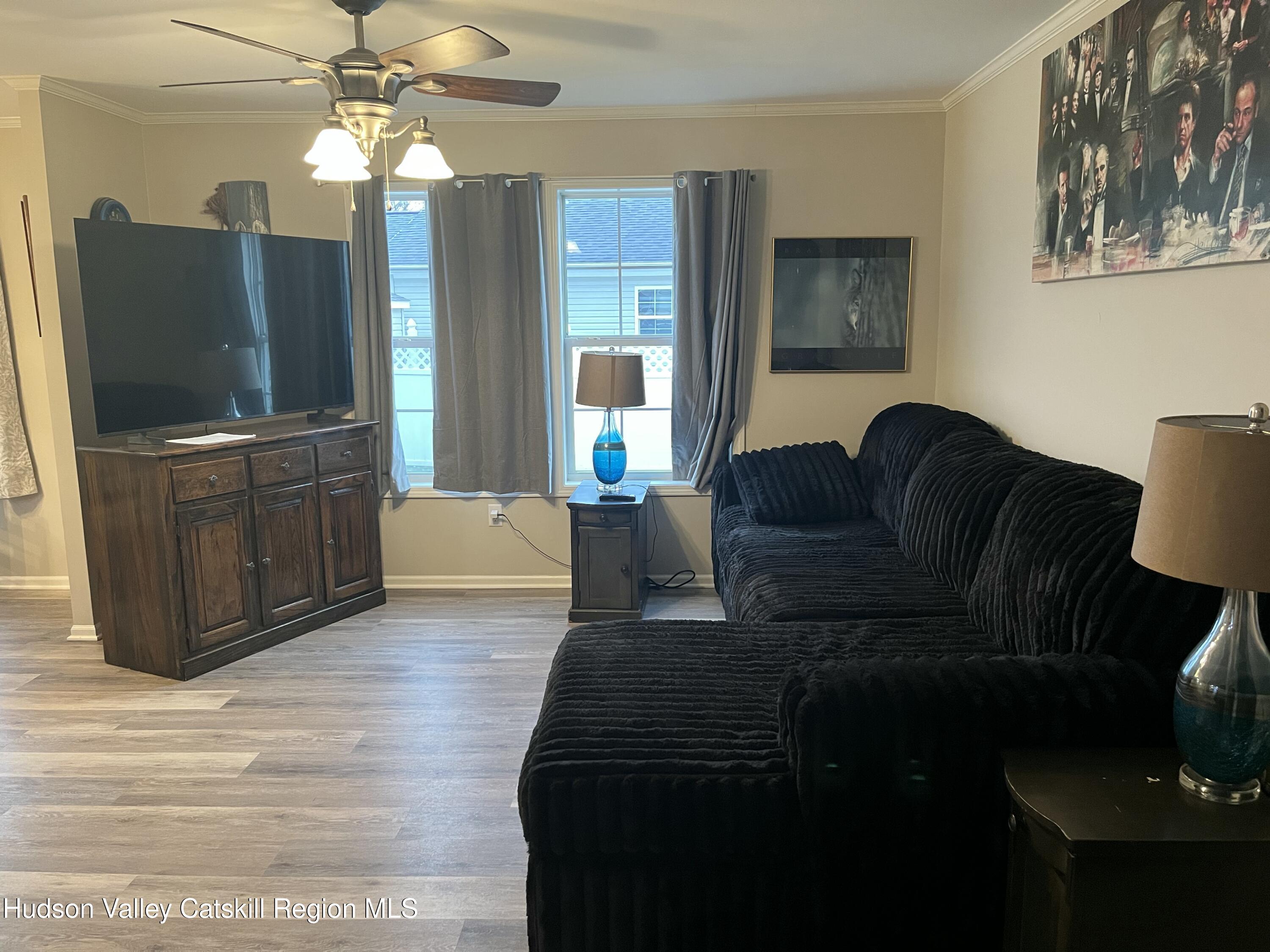 13 Mahoney Road Stuyvesant, NY 12173 - Photo 7 of 19 a living room with furniture and a flat screen tv