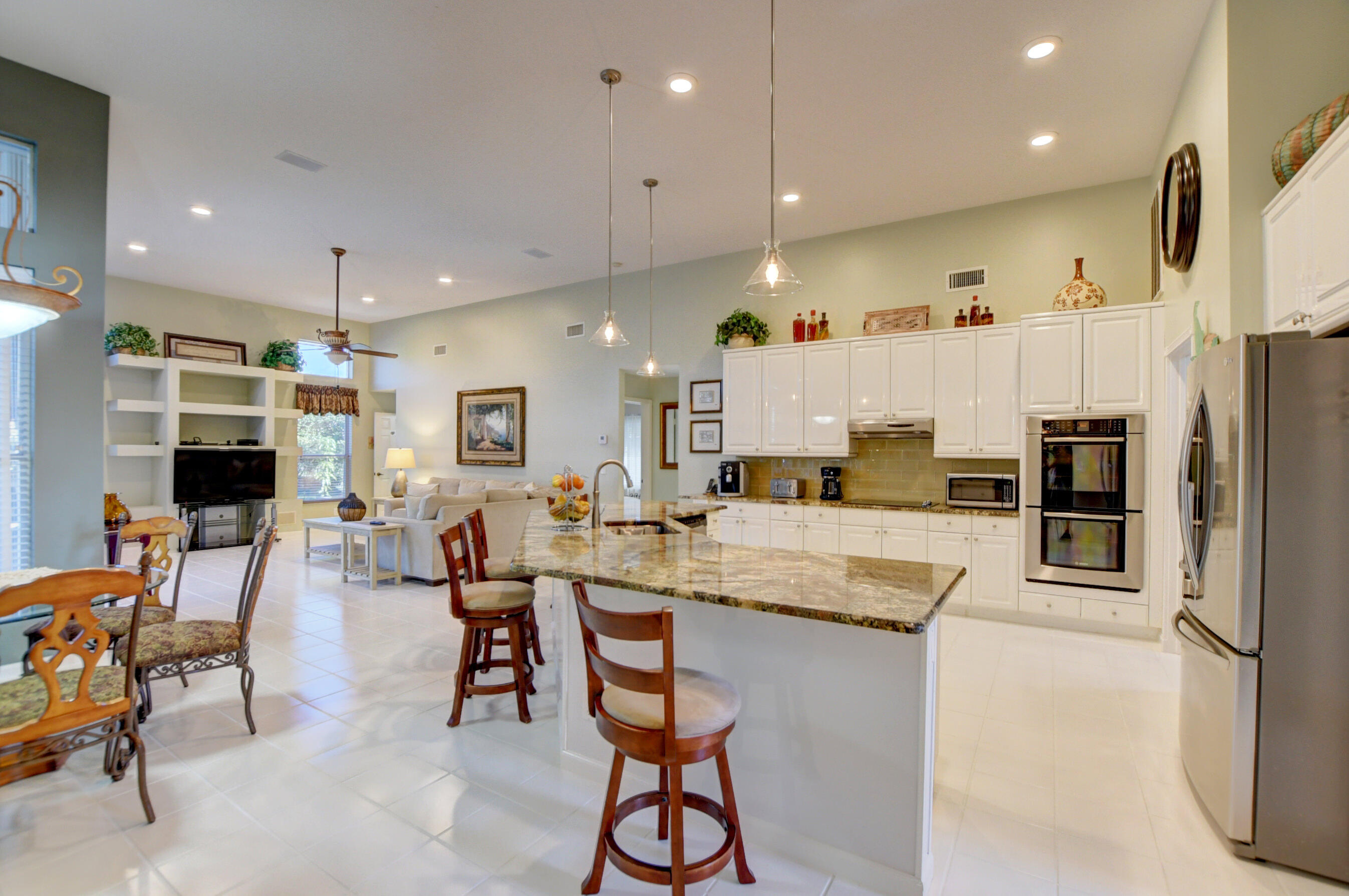 10546 Maple Chase Drive Boca Raton, FL 33498 - Photo 19 of 39 Living Room and Kitchen Open Concept