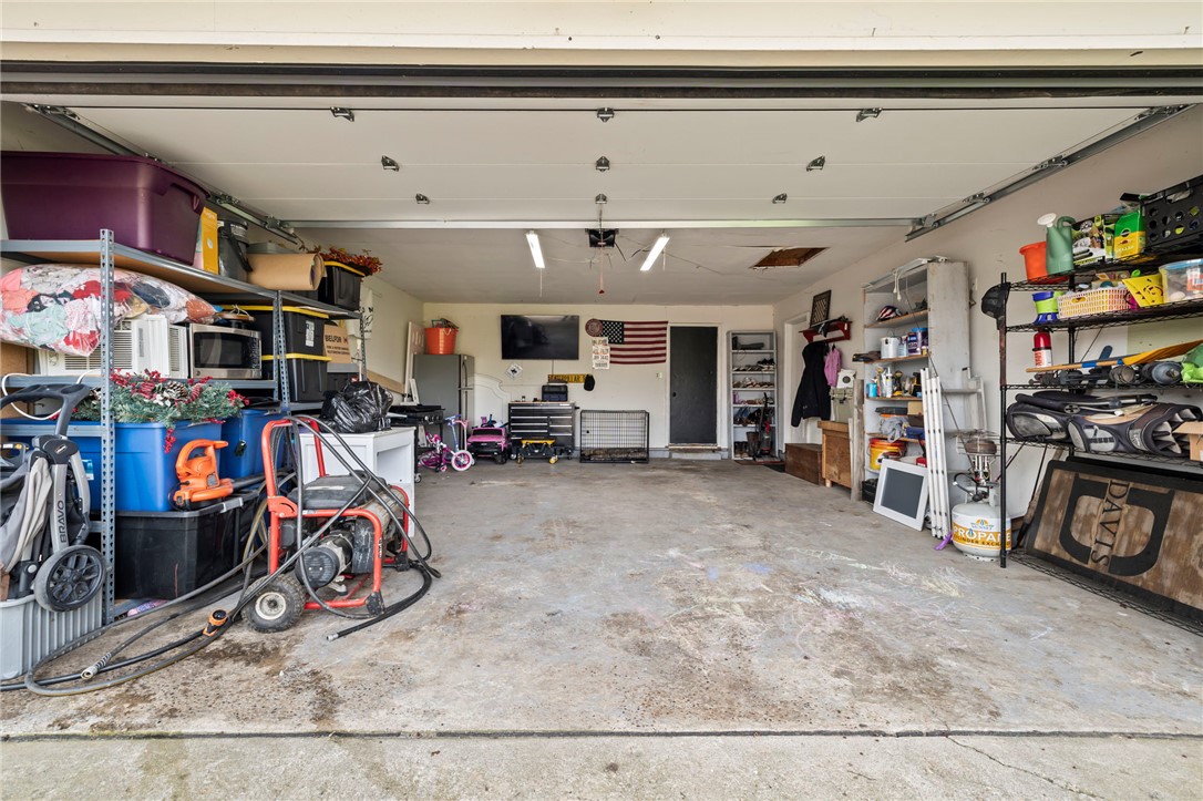 8969 Franklin-Trenton Road Franklin, OH 45005 - Photo 48 of 49 This spacious garage offers ample storage and direct access, enhancing daily convenience.