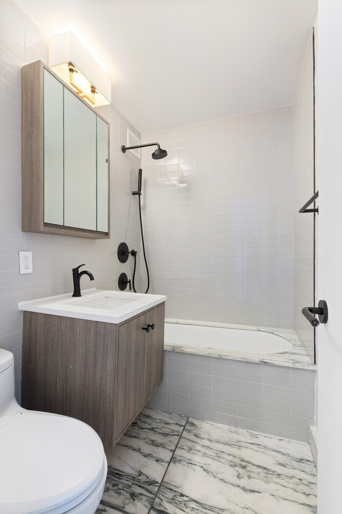 175 West 95th Street, Unit 7A Manhattan, NY 10025 - Photo 5 of 11 a bathroom with a sink a toilet and bathtub