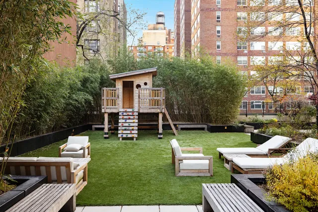 a view of a house with backyard porch and sitting area