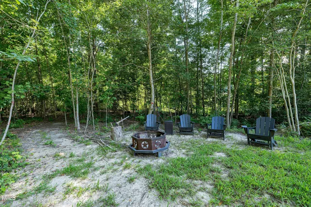 an aerial view of a house with yard