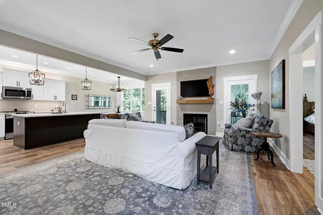 a living room with furniture and a fireplace