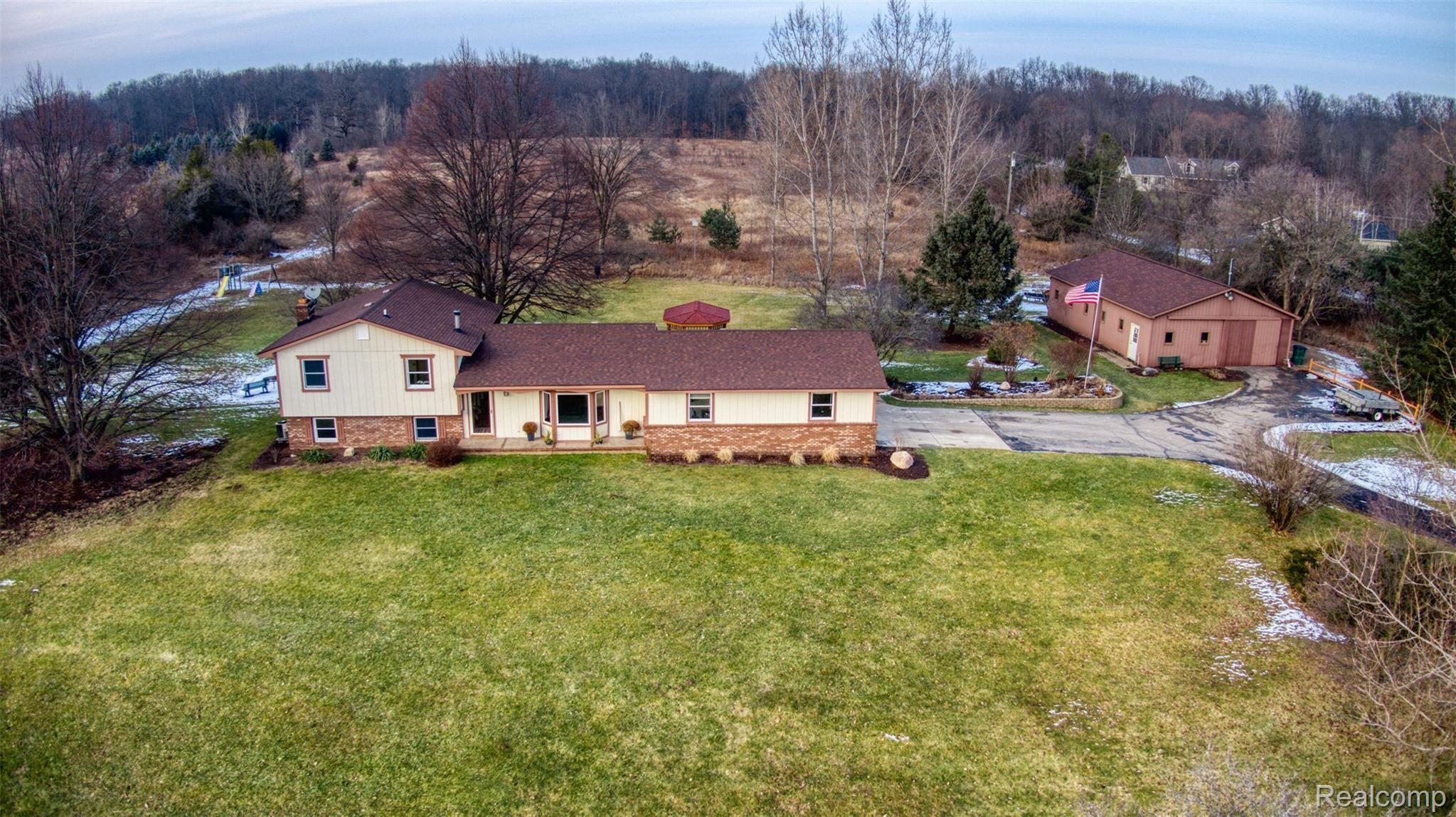 1550 Woodhaven Road Howell, MI 48855 - Photo 1 of 38 1550 Wood Haven front.jpg