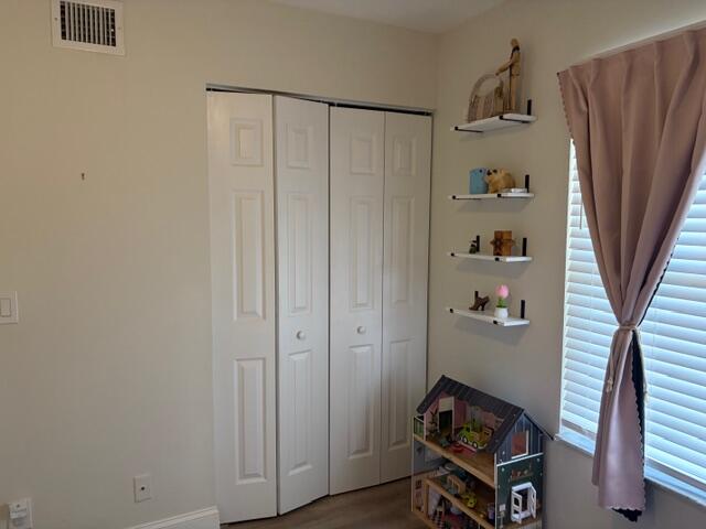 21906 Lake Forest Circle Boca Raton, FL 33433 - Photo 16 of 20 a living room with furniture and a gate